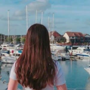 Ocean Village Marina in Southampton, with a woman in the foreground watching the boats